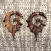 Wooden bat winged faux gauges